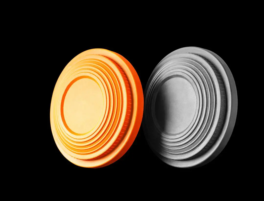 Closeup of two clay pigeon targets isolated on a black background