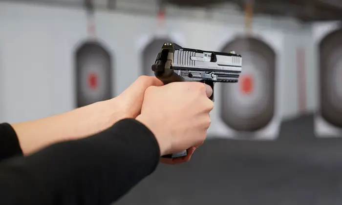 using a gun at a shooting range